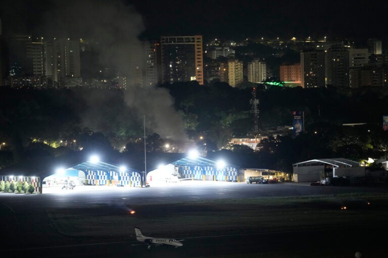 Smoke raises at La Carlota airport after explosions and low-flying aircraft were heard in Caracas, Venezuela