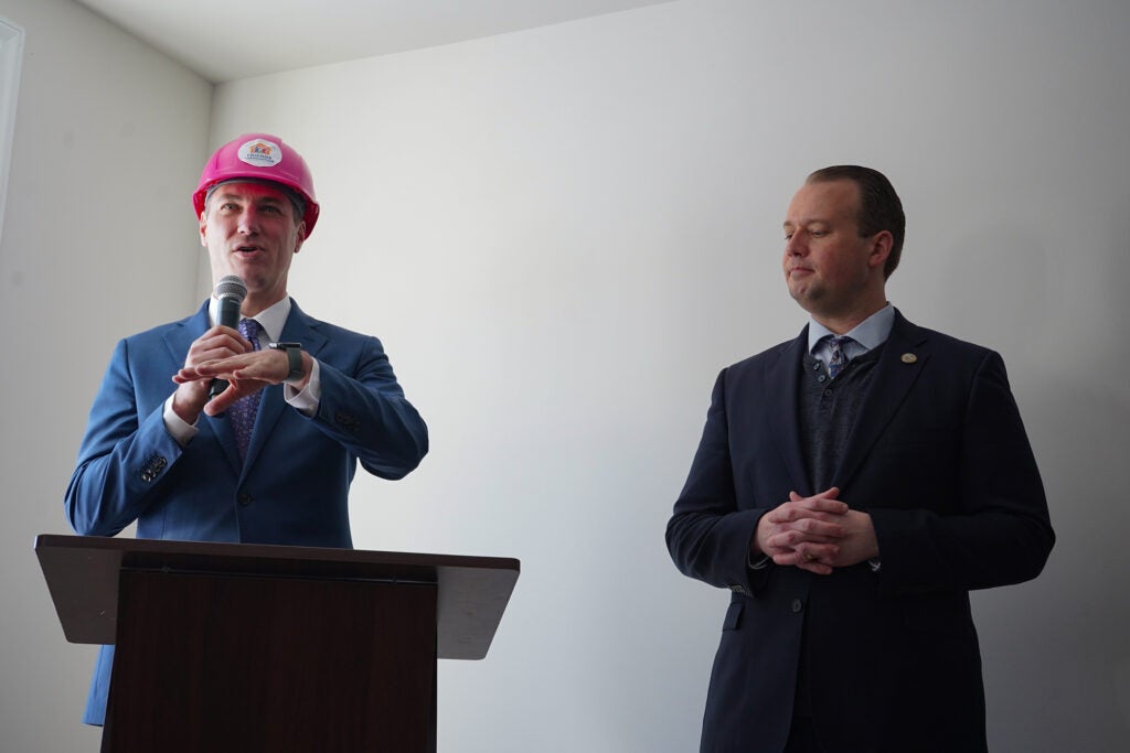 Josh Maxwell and Eric Roe speaking at the press conference