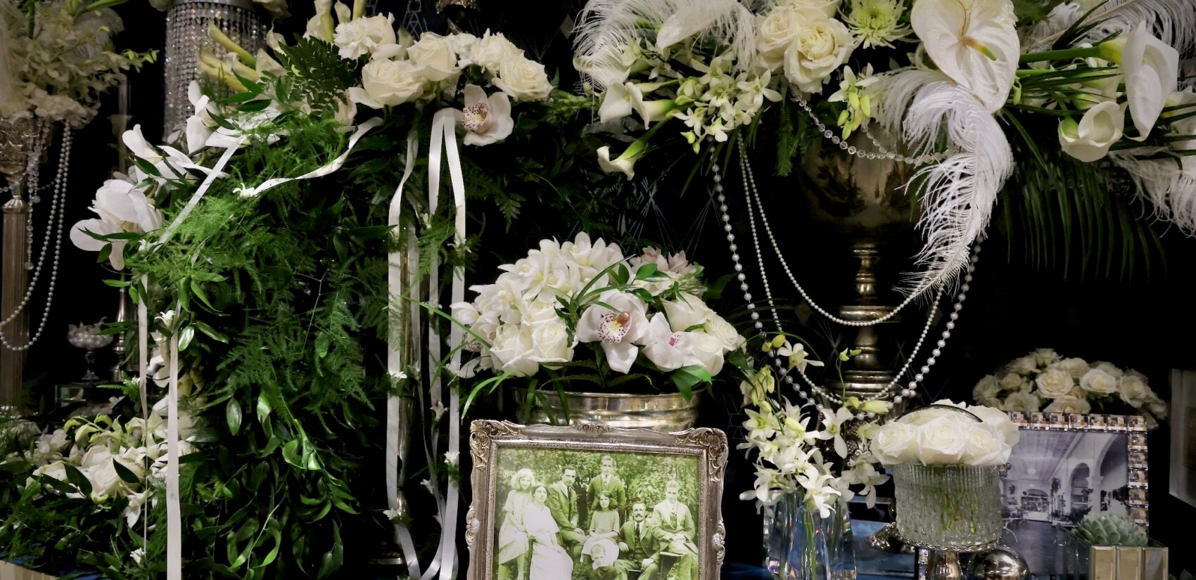 an old family photo in front of flowers