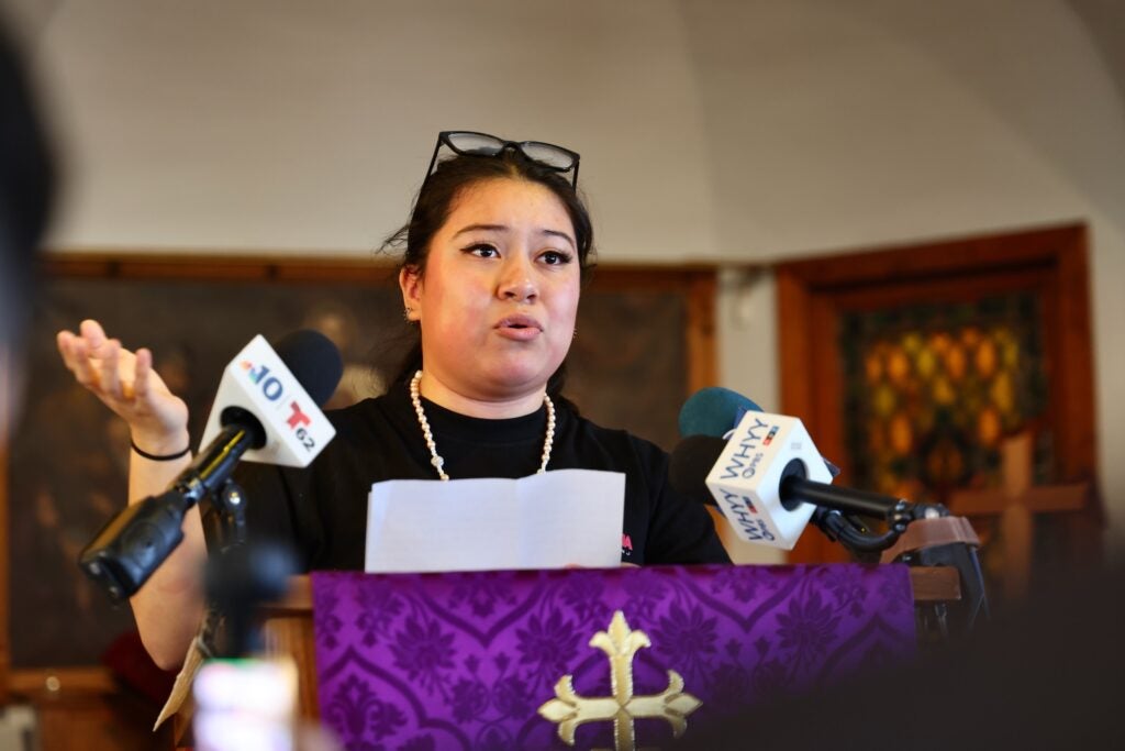 Jennifer Lopez speaking at a podium