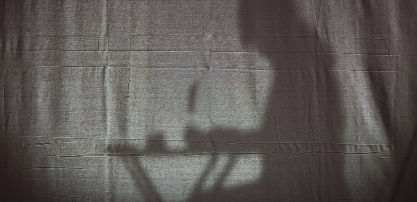 George Washington behind a curtain