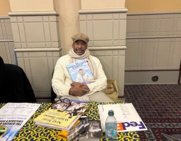 Illustrator E.B. Lewis poses with his newest book