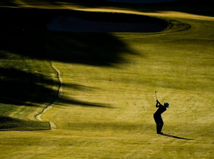 a golfer on the Aronimink Golf Club course