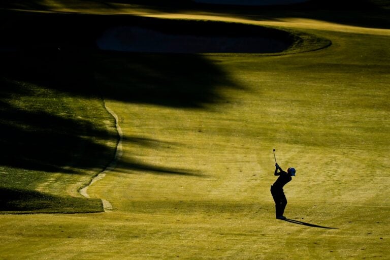 a golfer on the Aronimink Golf Club course