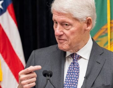 Bill Clinton speaking into a microphone