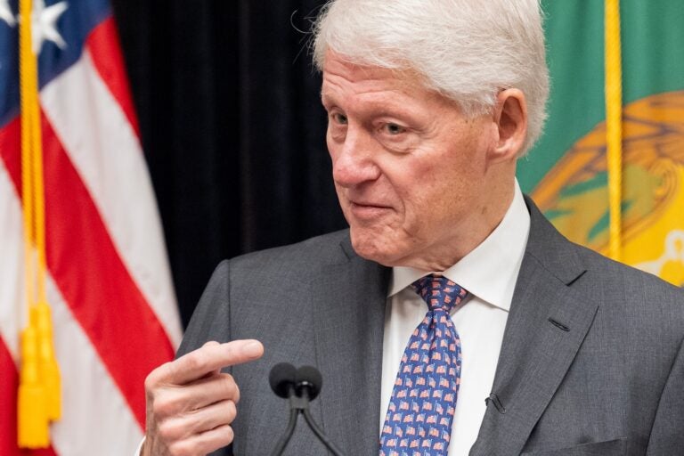 Bill Clinton speaking into a microphone