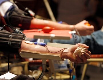 Two people donate blood