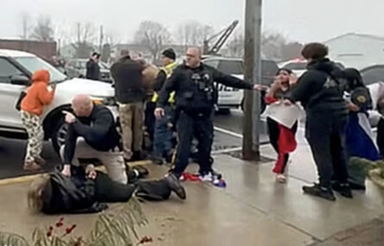 In a video screengrab, Quakertown police officers are seen arresting someone outside Sunday’s Deli & Restaurant, where students had gathered to protest ICE on Feb. 20, 2026.