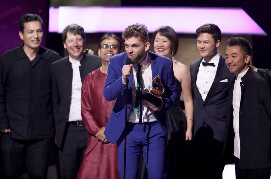 Johnny Gandelsman, and members of the Silk Road Ensemble, accept the award for best world music album for "Sing Me Home" at the 59th annual Grammy Awards 