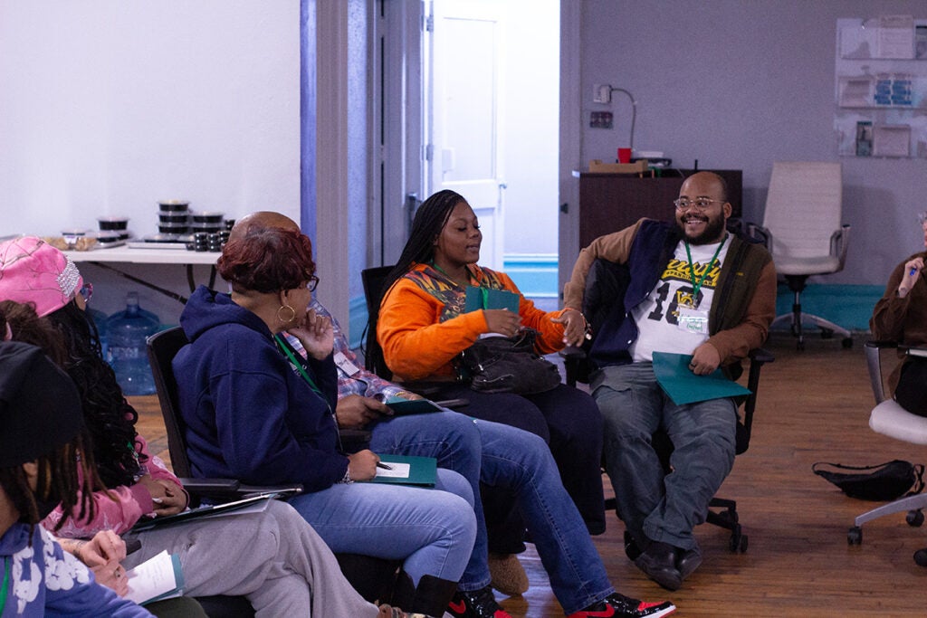 Attendees of the workshop sitting and talking