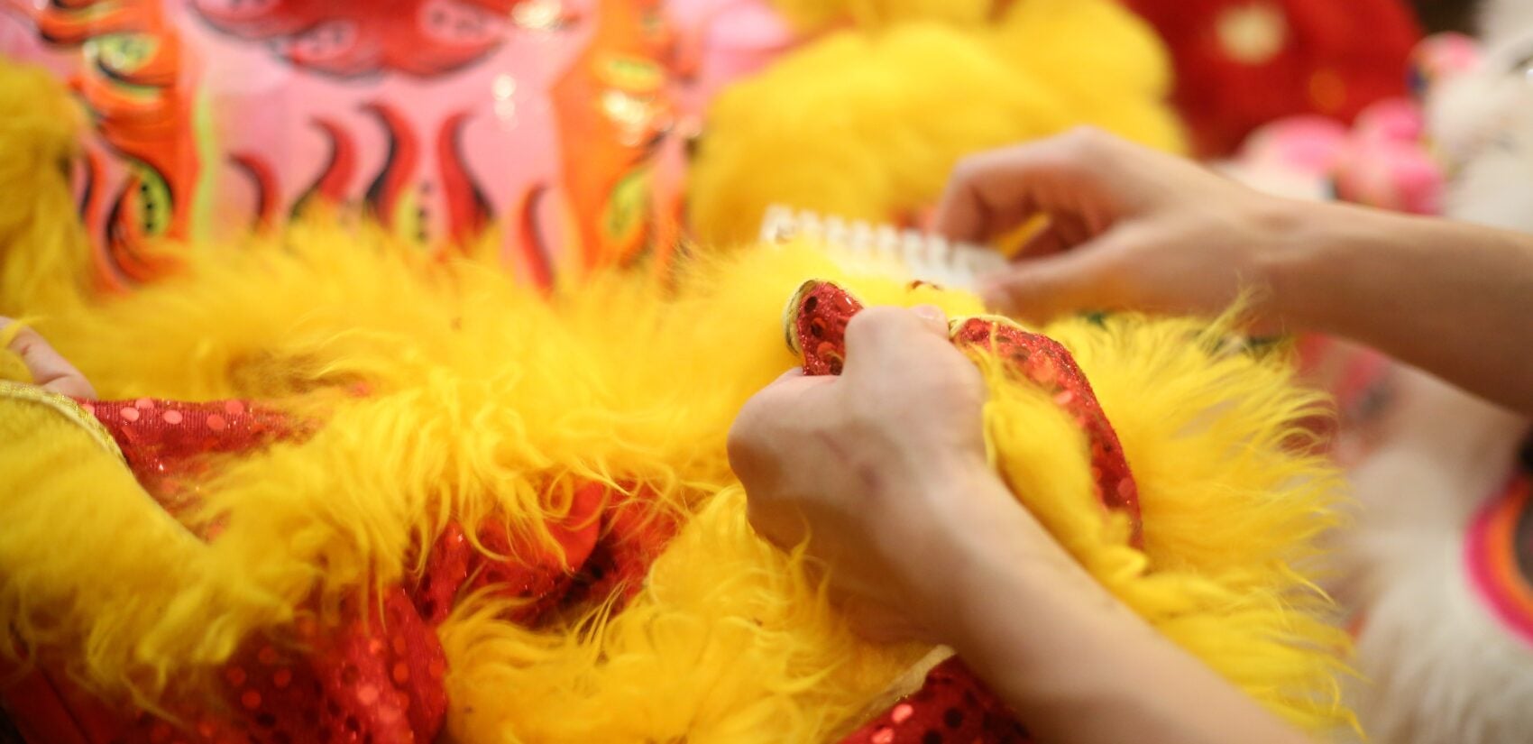 a fabric lion head being worked on