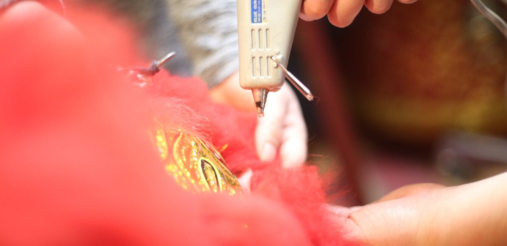 a fabric lion head being worked on