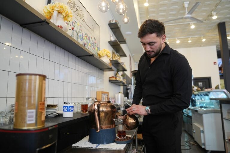 Muhammed Emanet pours Turkish tea