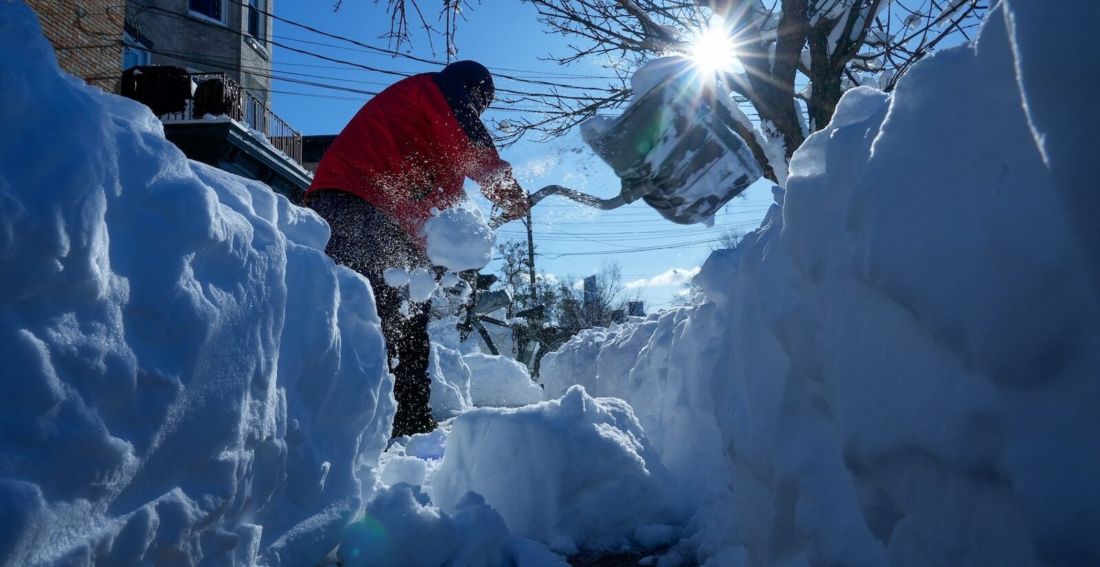 Luis Javier Rodriguez clears snow from a sidewalk, Tuesday, Feb. 24, 2026, in Weekhawken, N.J.