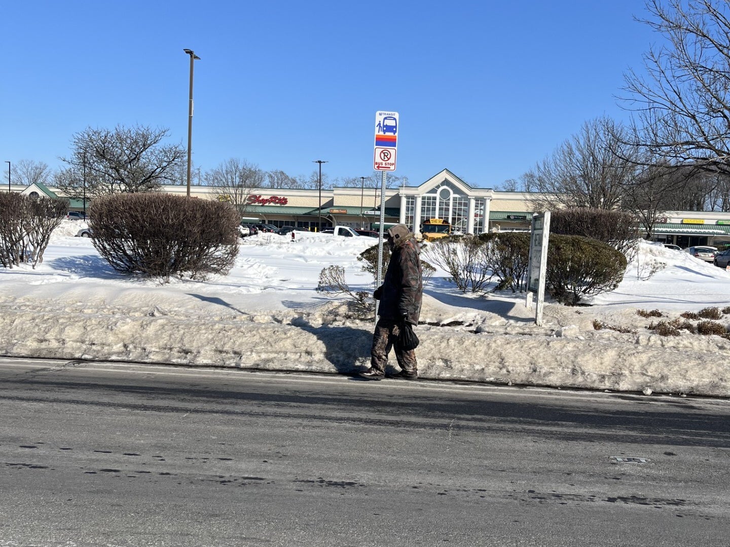 a man waits on a NJ Transit bus