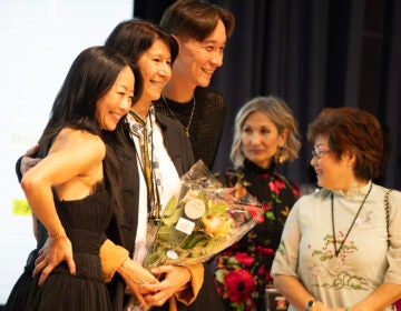 Director Jennifer Lin (center standing) with Sun Mi Cho and Paul Chan at a screening of Lin's documentary  