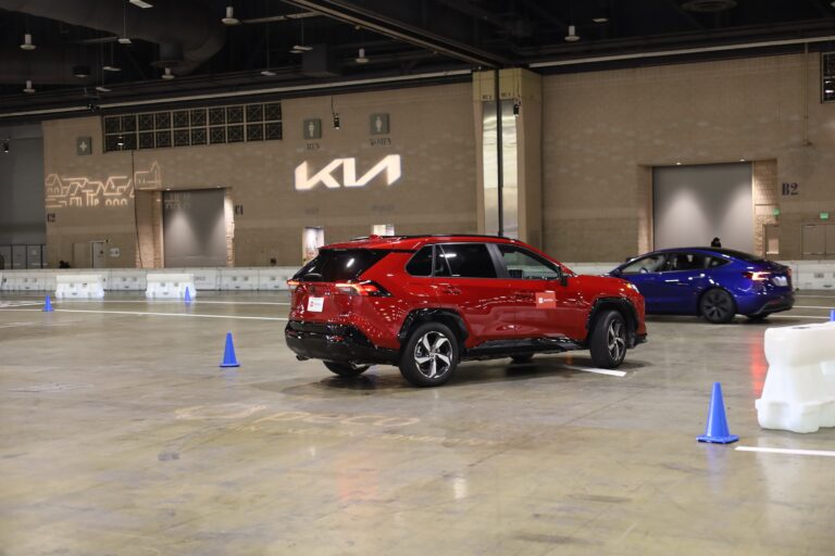 Test driving a car on the floor of the auto show