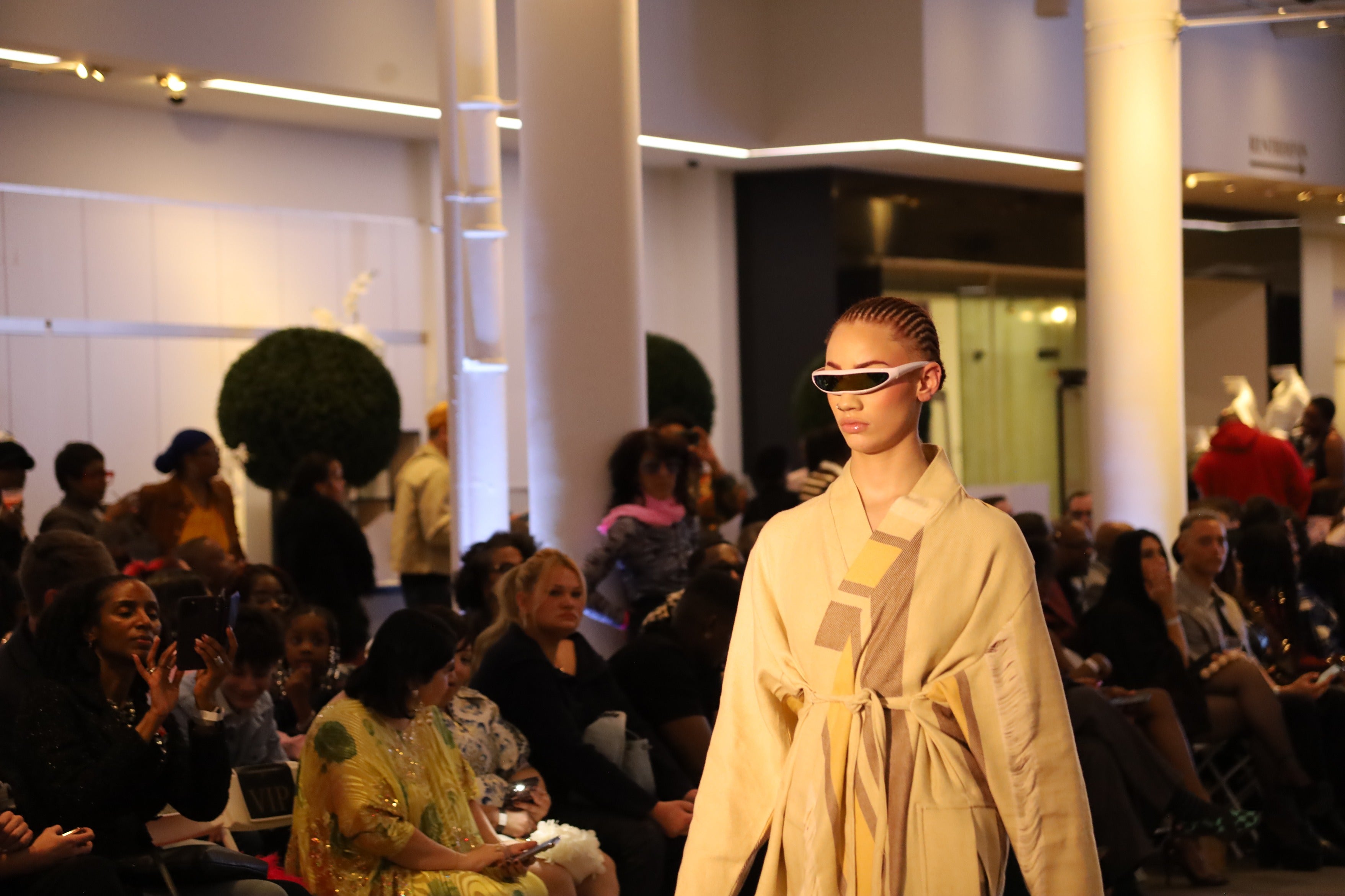 a model wears unique sunglasses