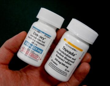 two bottles, of Truvada and Descovy