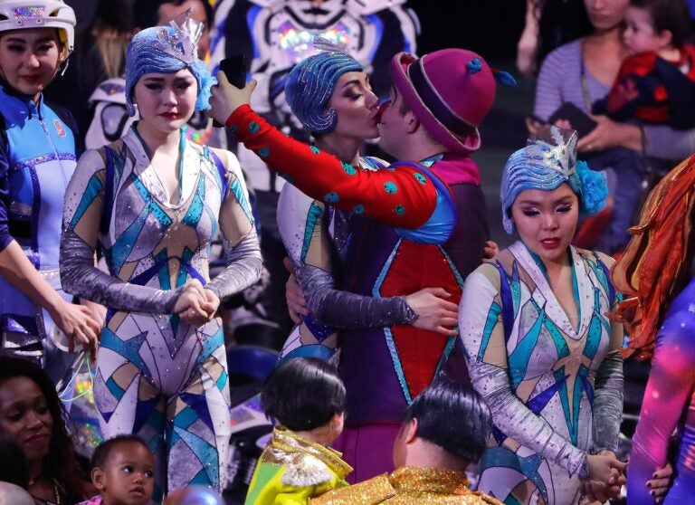 Two performers kiss at the end of the final show of the Ringling Bros. and Barnum & Bailey Circus