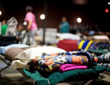 Joplin Missouri deadly F5 Tornado homeless shelther Many beds lined up in a homeless shelter