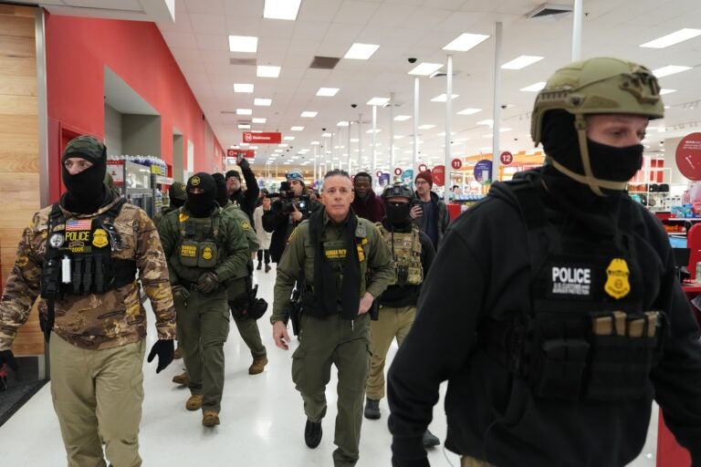 FILE - U.S. Border Patrol Cmdr. Gregory Bovino walks through a Target