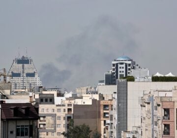 Iran US Israel Smoke can be seen in the background of the downtown skyline in Tehran after an explosion