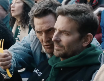 Actors Matthew McConaughey (left) and Bradley Cooper appear in an Uber Eats Super Bowl ad.