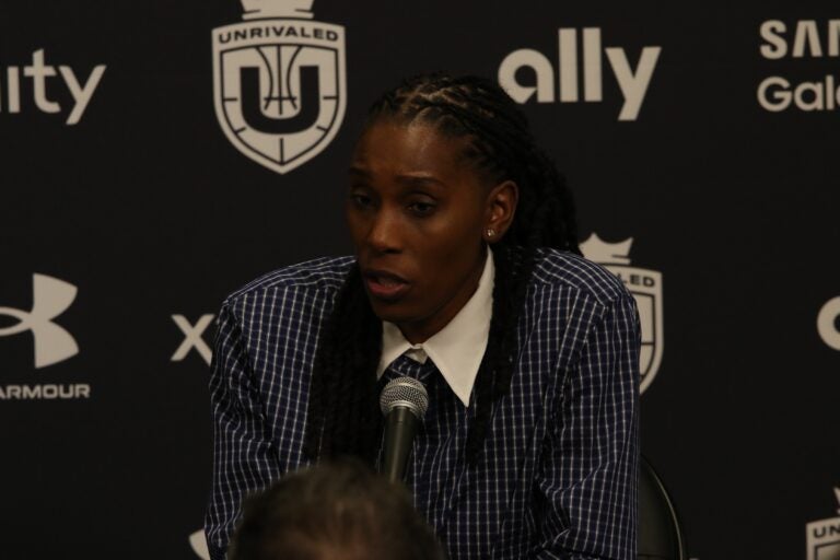 Roneeka Hodges speaks into a microphone
