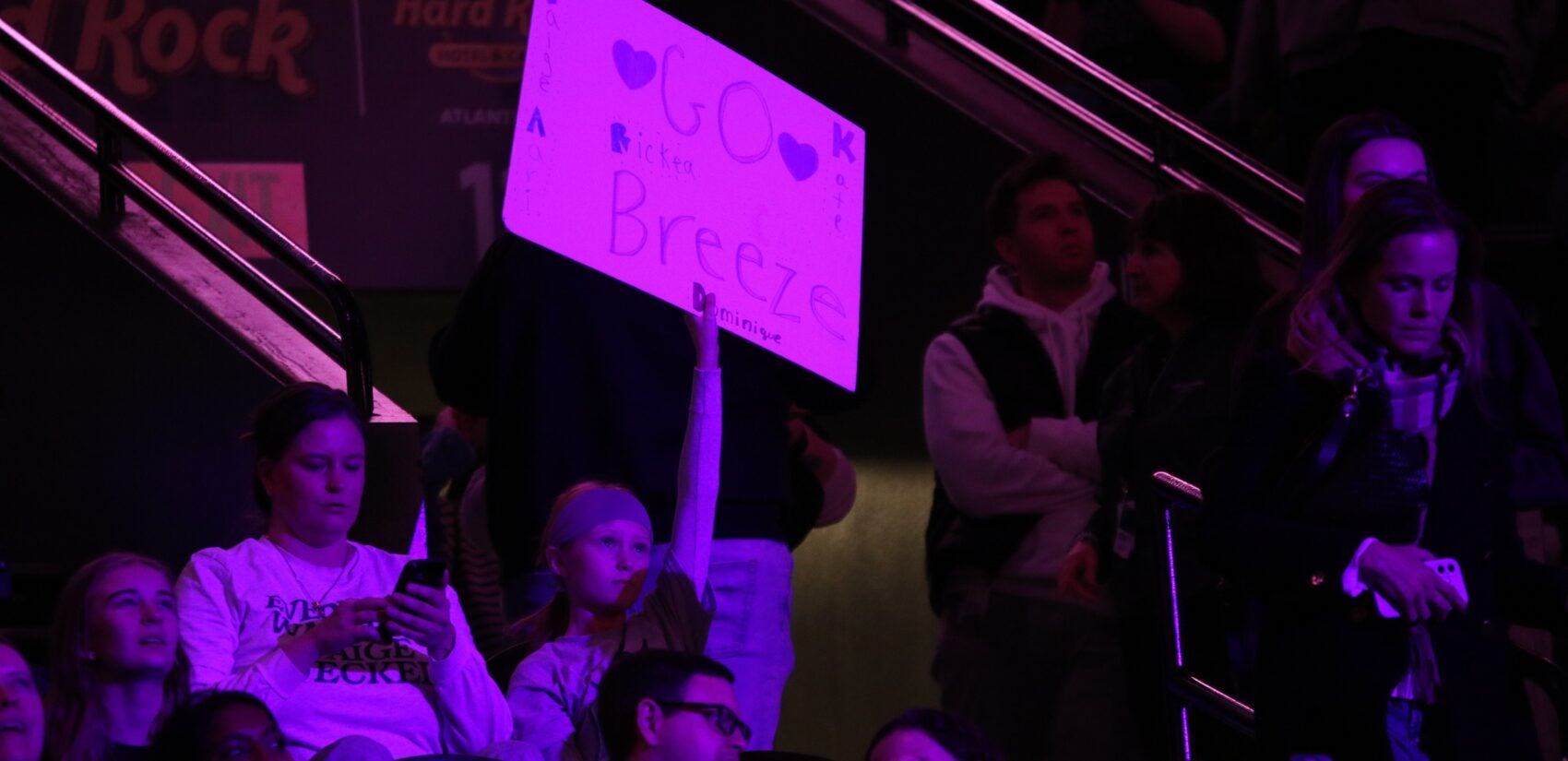 a fan holds a sign reading GO Breeze