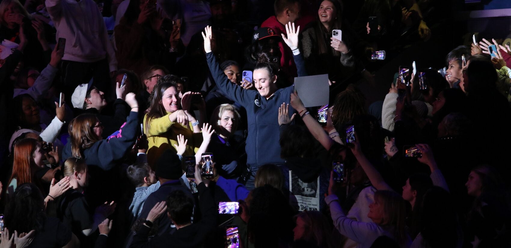 fans cheer on Marina Mabrey in the stands