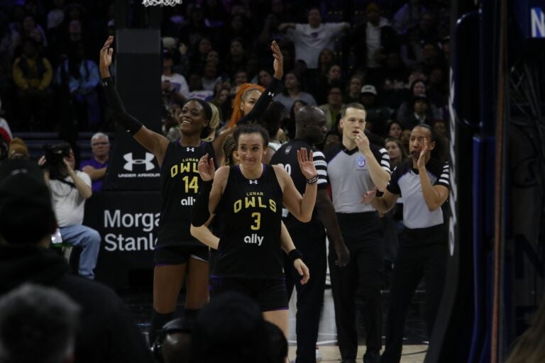 Marina Mabrey holds up her hands on the court