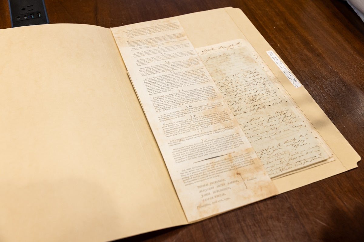 An old book lies open on a table