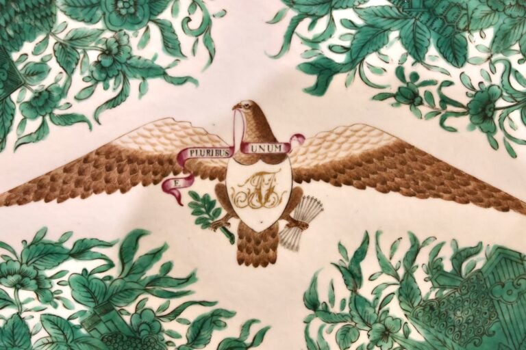 A depiction of an eagle with the words 'Pluribus Unim' on a ribbon in the Eagle's mouth.