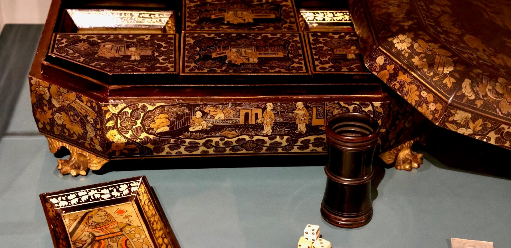 An intricately designed box with game pieces on display.