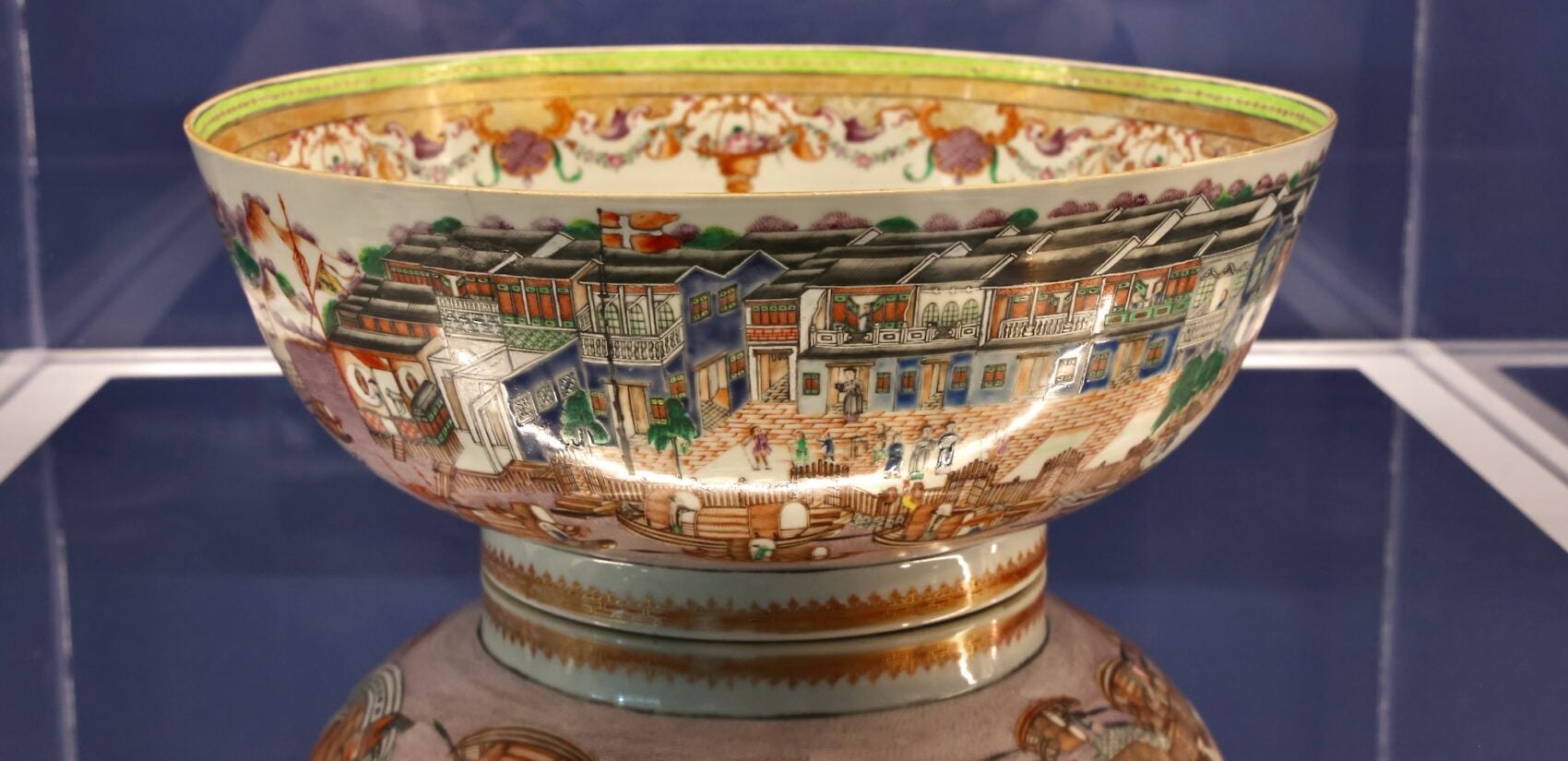 A highly decorative porcelain bowl is part of the exhibit.