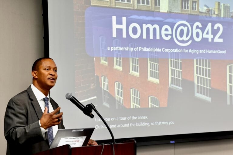 Najji Orr is speaking at podium while giving a presentation.