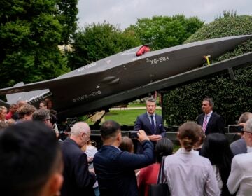 Secretary of Defense Pete Hegseth and Under Secretary of Defense for Research and Engineering Emil Michael speak to reporters before looking at a display of multi-domain autonomous systems in the Pentagon courtyard, Wednesday, July 16, 2025, in Washington. (AP Photo/Julia Demaree Nikhinson)