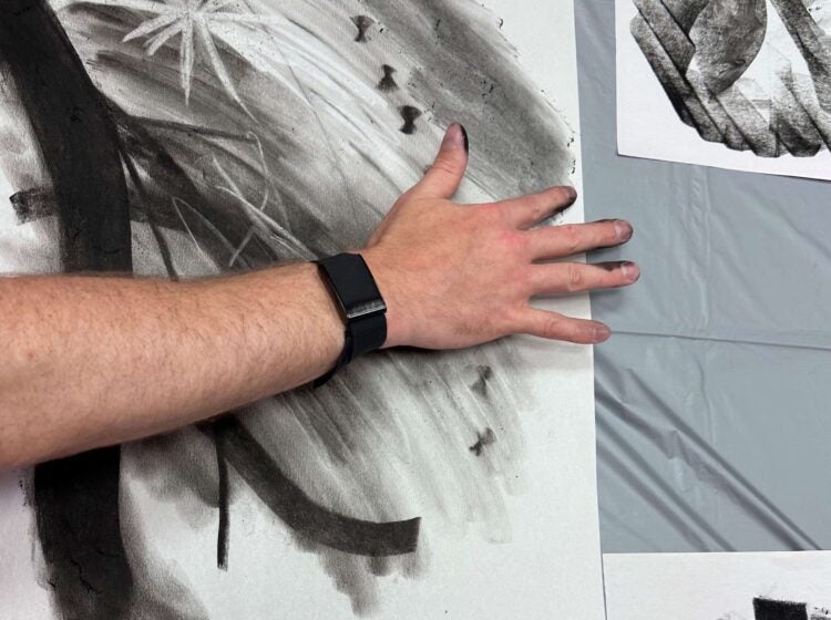 hand-painting with charcoal