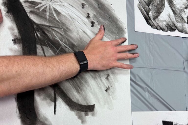 hand-painting with charcoal