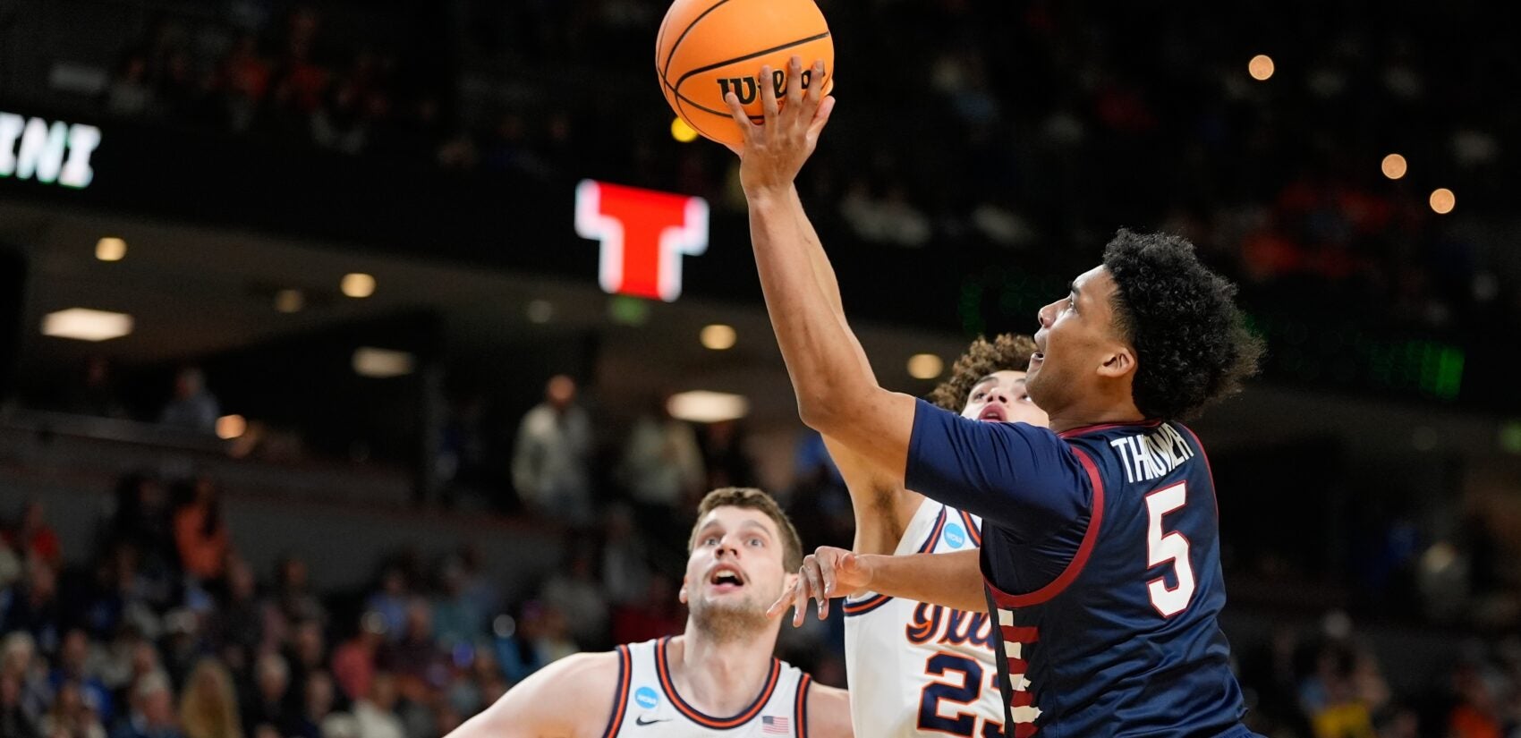 Cam Thrower attempts a layup