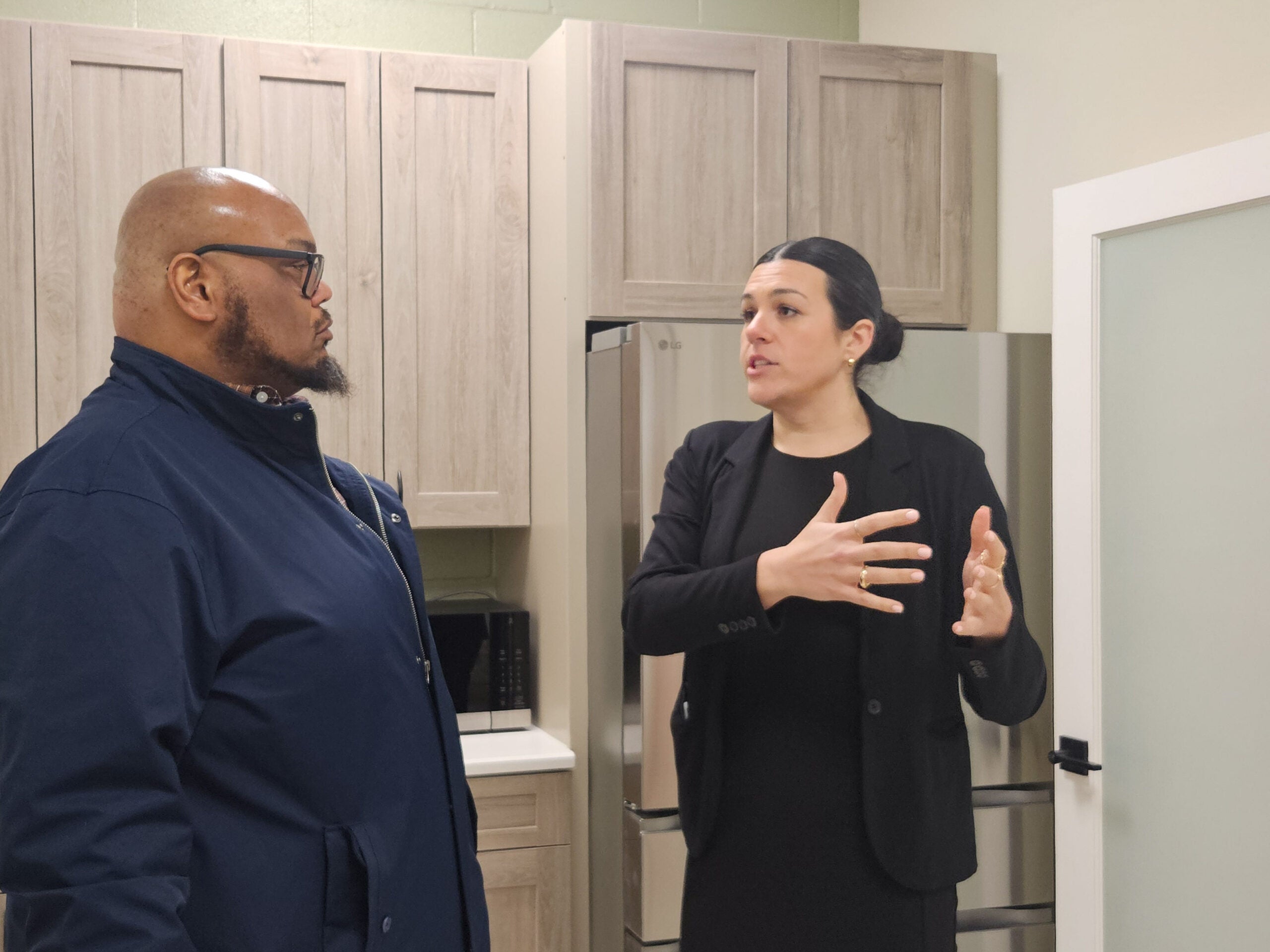 Victoria Nicolosi speaks to a man