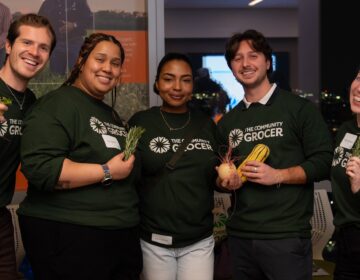 5 people posing for a photo together.
