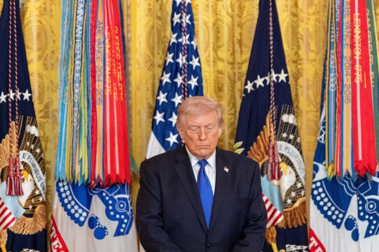 President Donald Trump stands