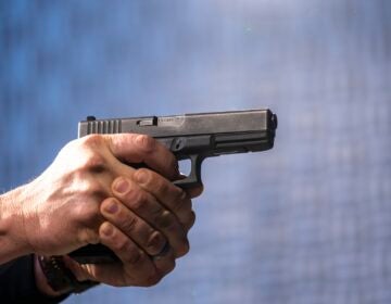 A semi-automatic Glock pistol is fired