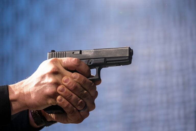 A semi-automatic Glock pistol is fired