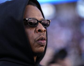 Jay-Z looks on