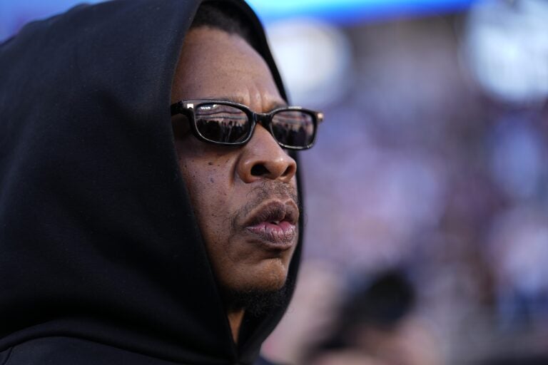 Jay-Z looks on