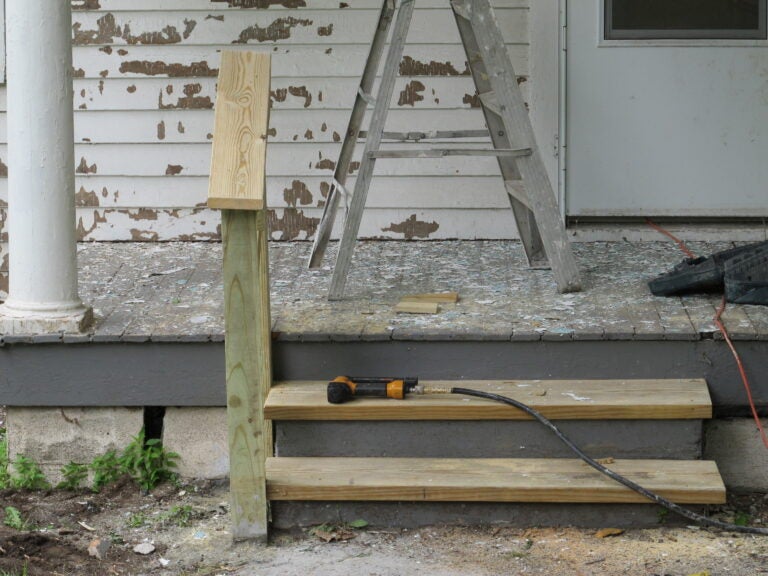 the front porch of a home with chipped lead paint