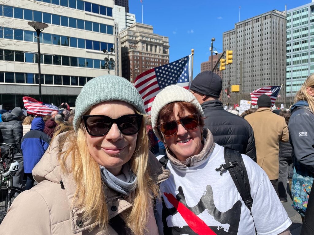 Two women pose for a photo as they participate in the "No Kings" protest in Philadelphia